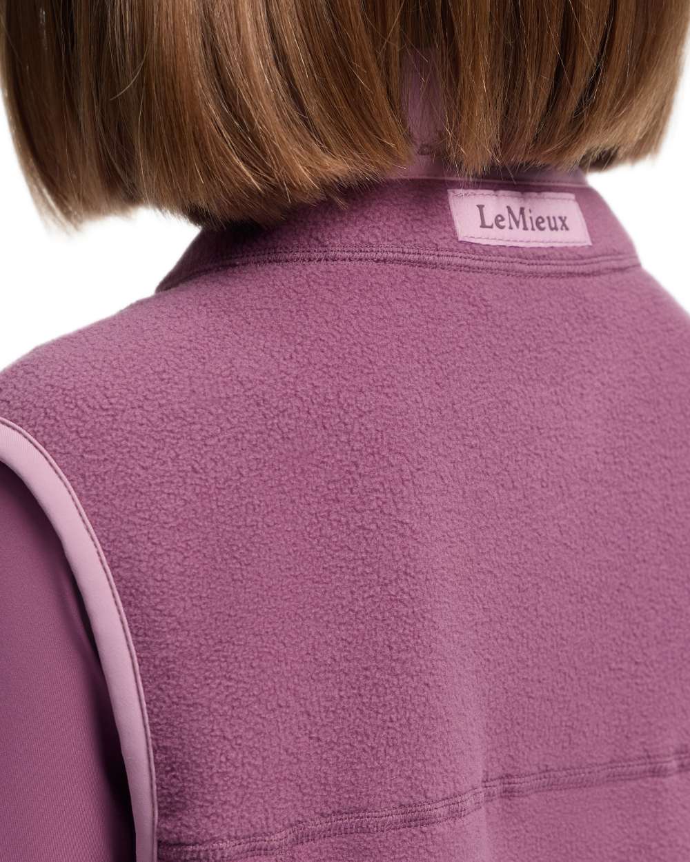 Mallow coloured LeMieux Childrens Bobbi Fleece Gilet on white background