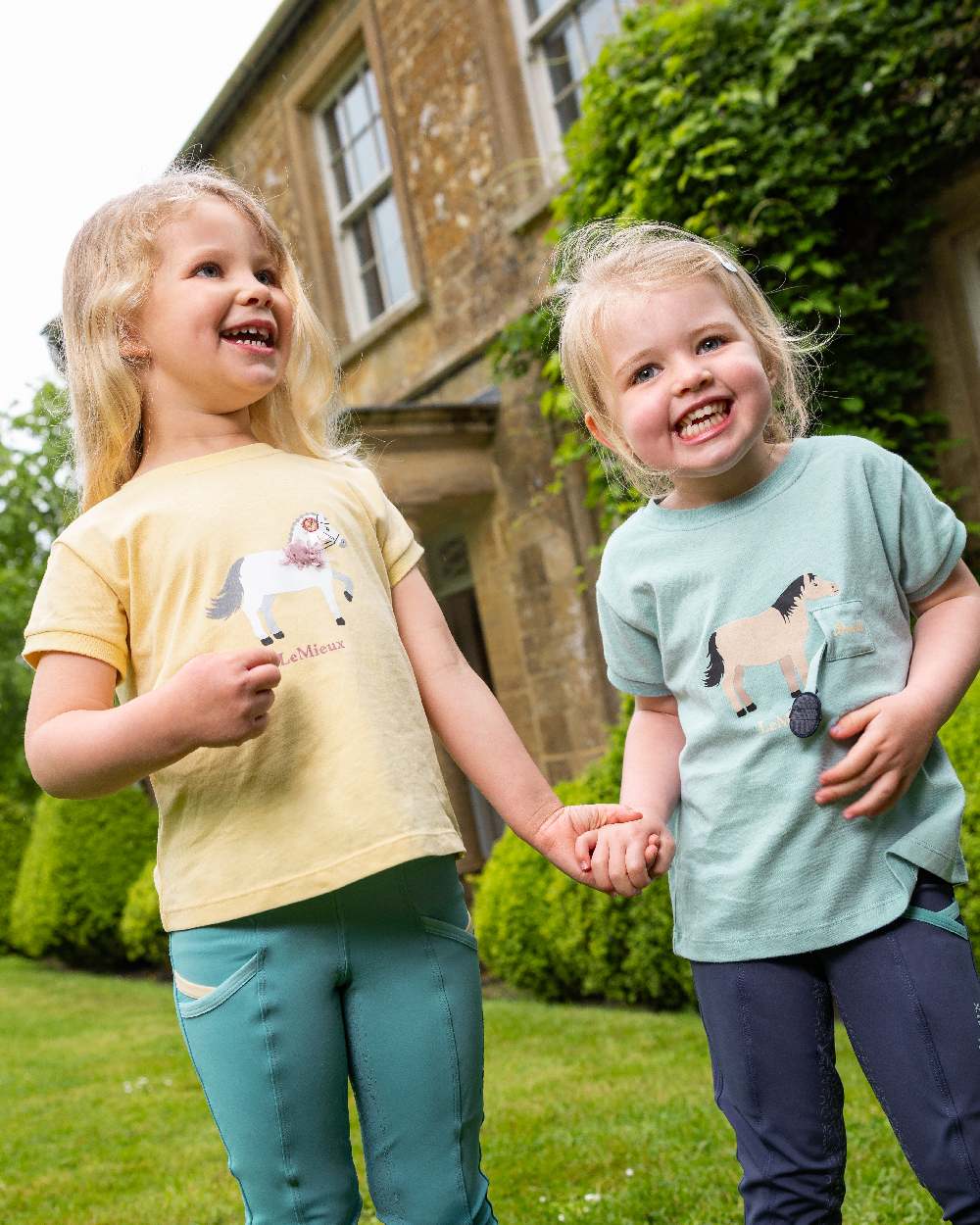 Mimosa coloured LeMieux Childrens Mini Alex Tee on backyard background