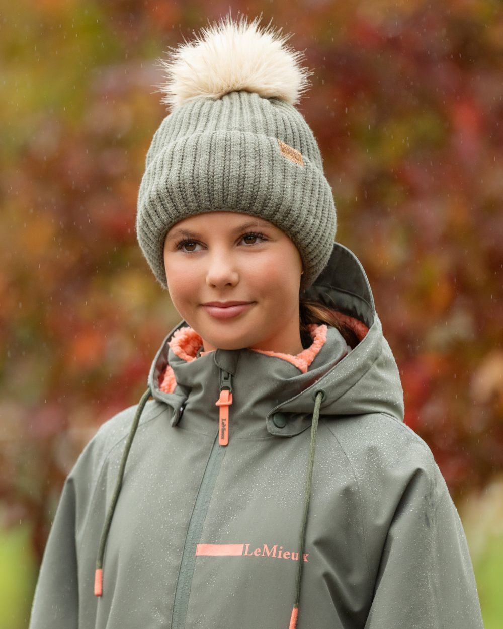 Rosemary coloured LeMieux Clara Rib Beanie on blurry background