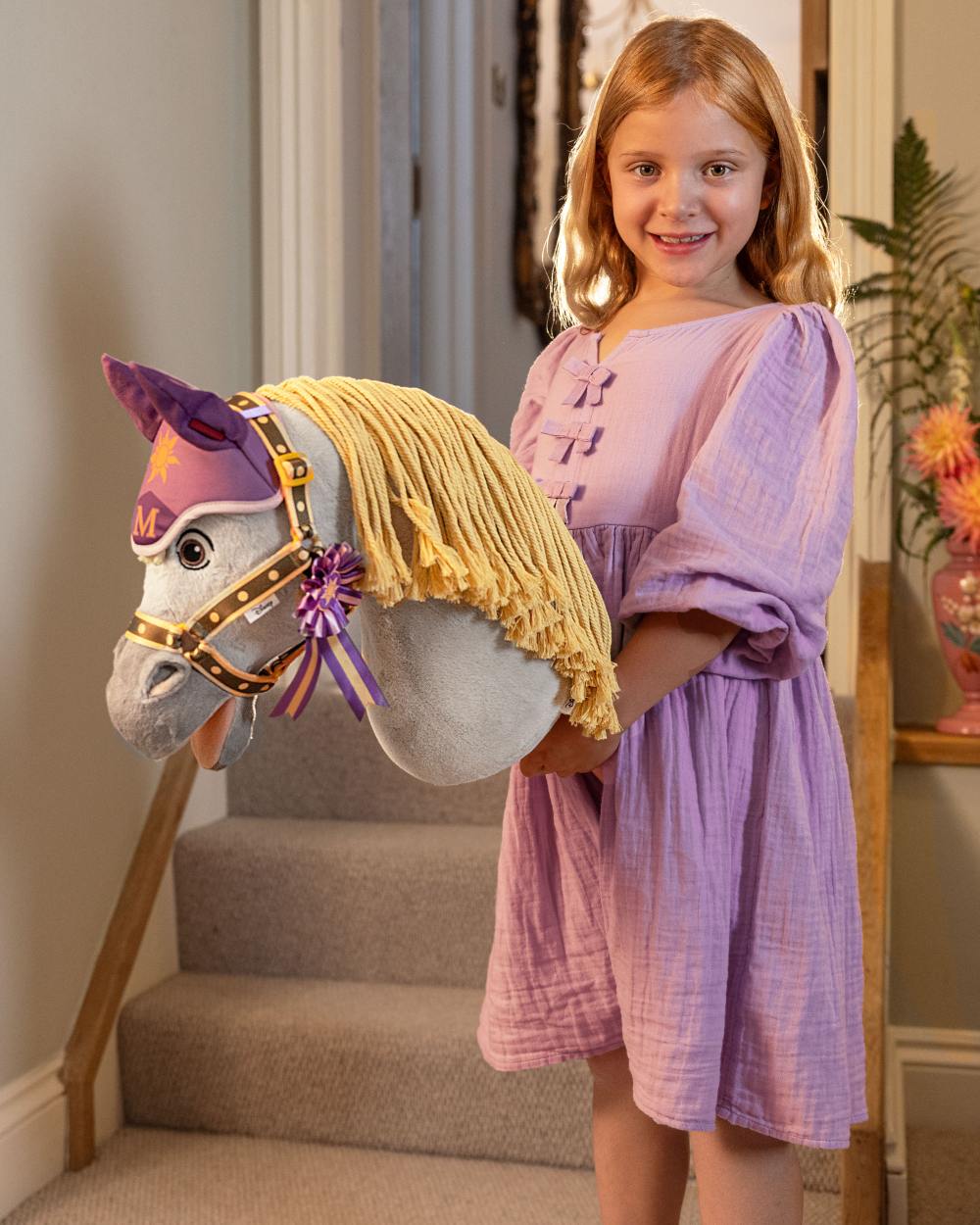 Maximus coloured LeMieux Disney Hobby Horse Maximus on house background