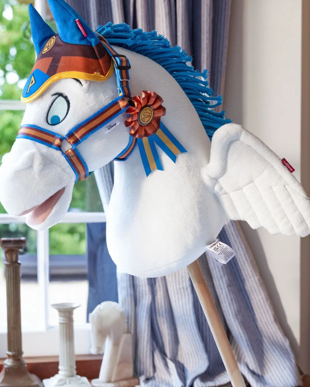 Pegasus coloured LeMieux Disney Hobby Horse Pegasus on house background