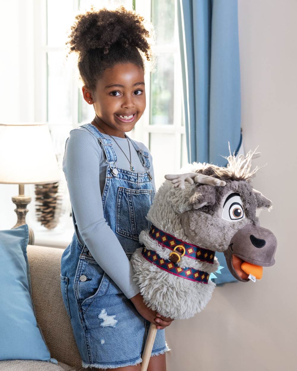 Sven coloured LeMieux Disney Hobby Horse Sven on house background