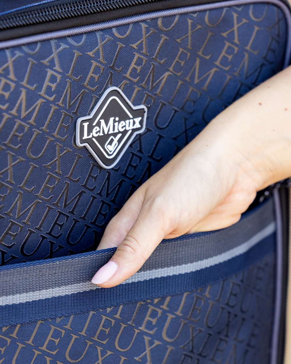 Navy coloured LeMieux Elite Pro Bridle Bag on outdoor background