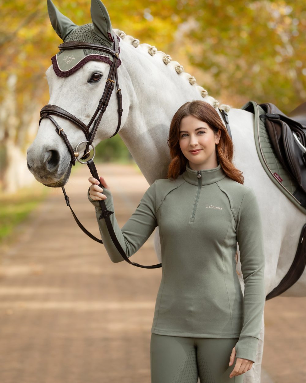 Rosemary coloured LeMieux Frances Quarter Zip Fleece on tree background