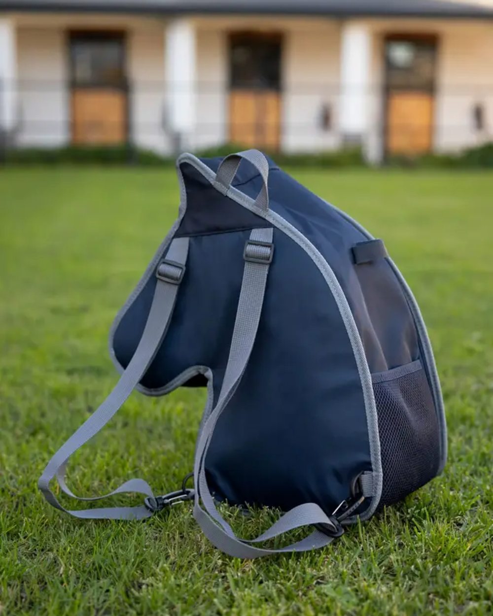 Navy coloured LeMieux Hobby Horse Carry Bag on garden background