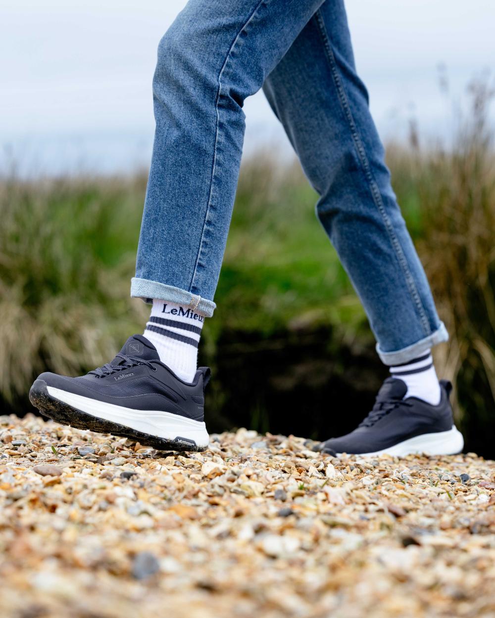 Navy coloured LeMieux Womens Kanta Waterproof Trainers on beach background