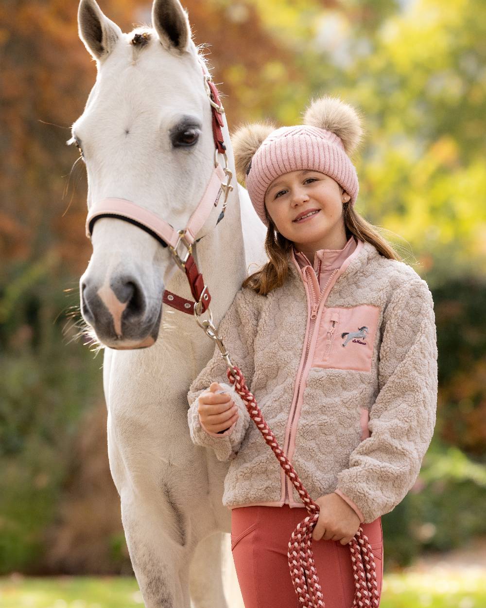 Stone Coloured LeMieux Kids Mini Thora Heart Fleece on Outdoor Field Background