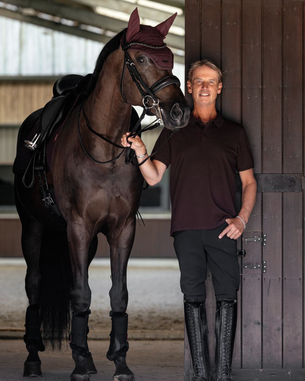 Damson coloured LeMieux Mens Classique Polo T-Shirt on stable background