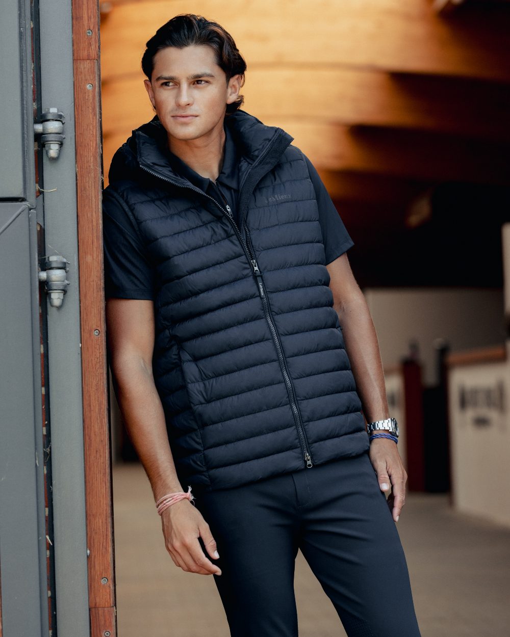 Navy coloured LeMieux Mens Hooded Puffer Gilet on outdoor background