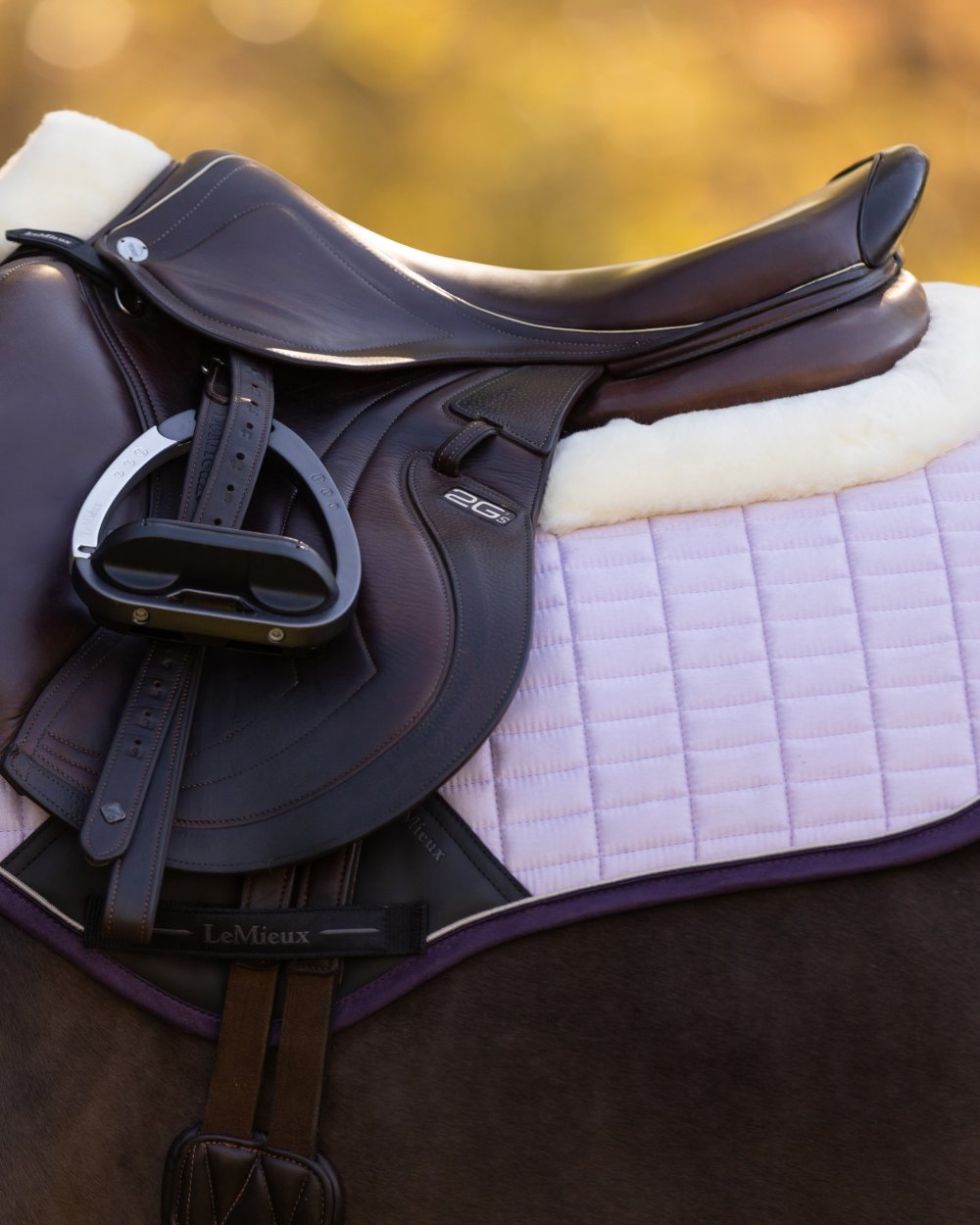 Lilac coloured LeMieux Merino Suede Close Contact Square on tree background