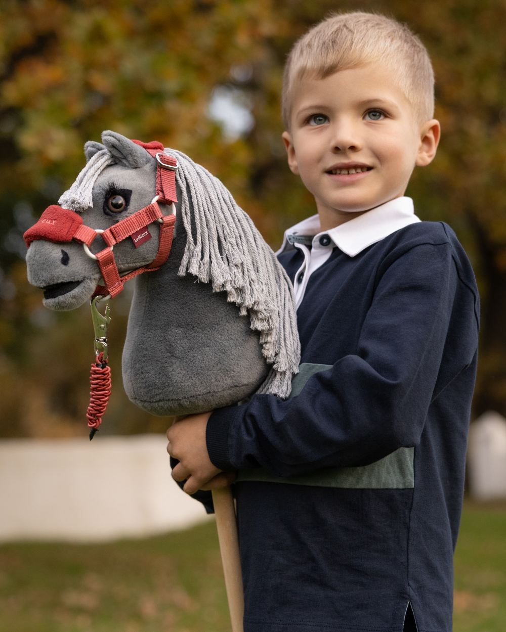 Smokey coloured LeMieux Mini Hobby Horse Smokey on outdoor background