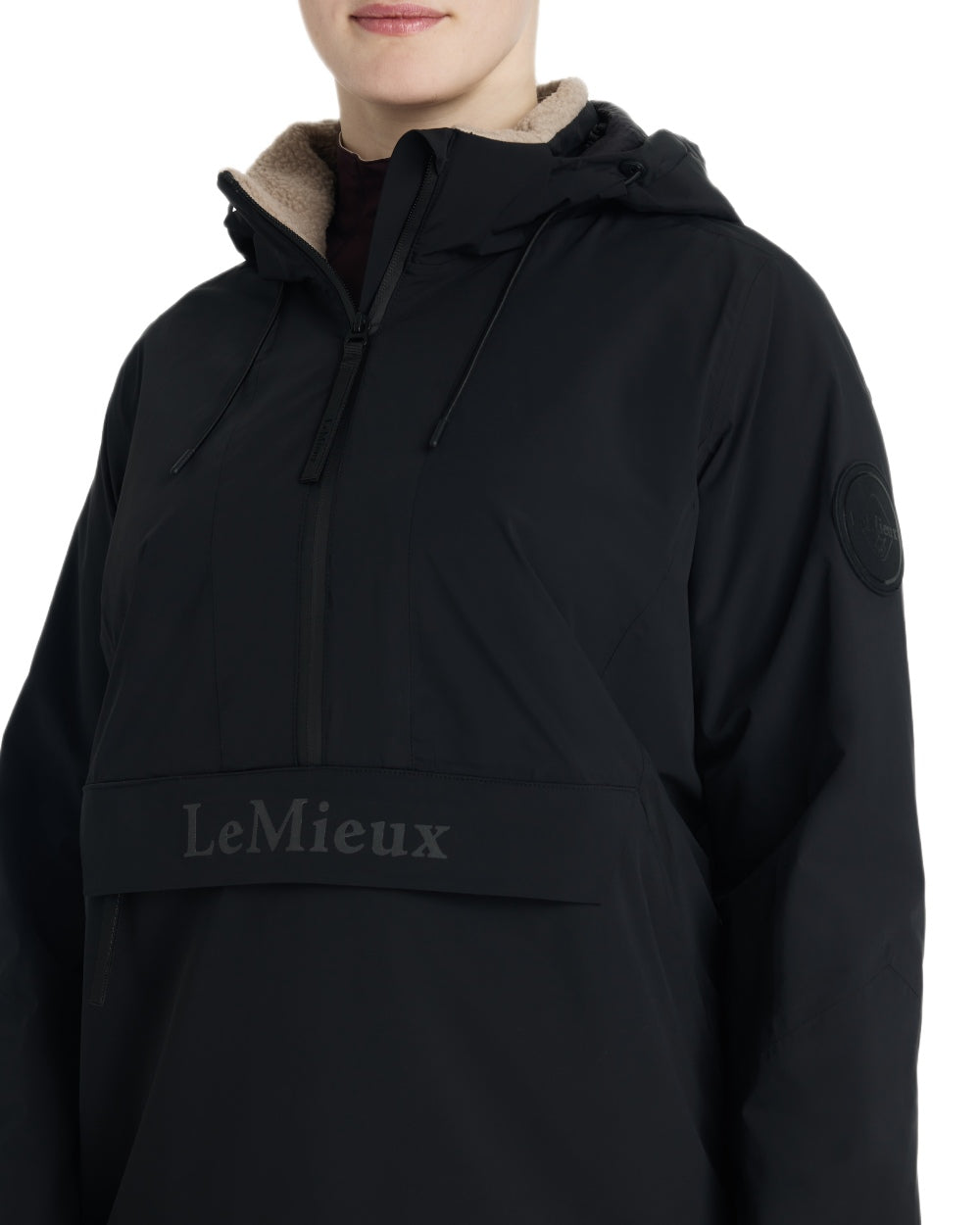 Black coloured LeMieux Phoebe Half Zip Waterproof Anorak on white background