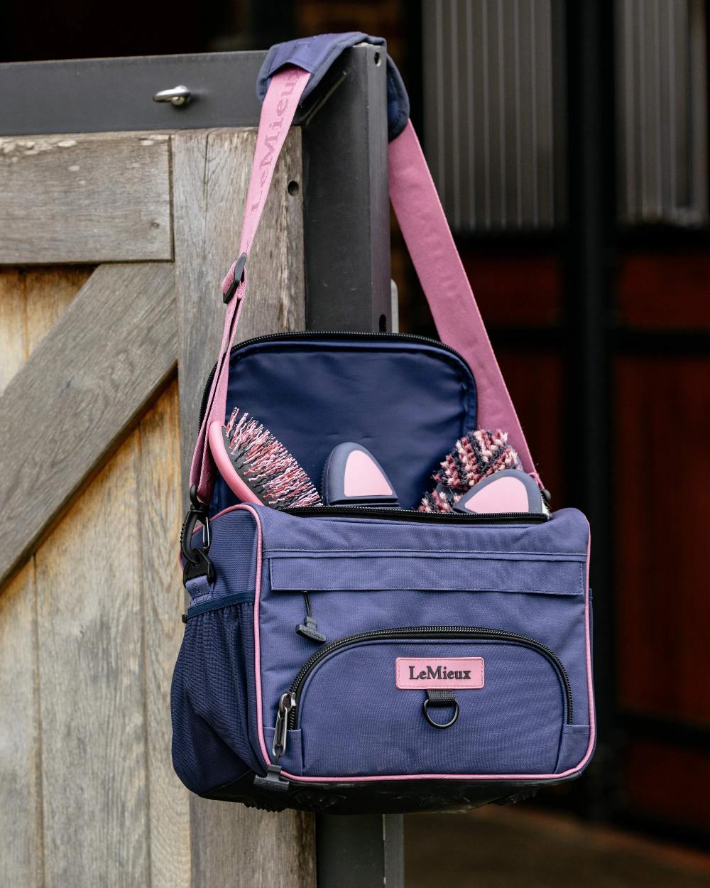 Dusk Blue coloured LeMieux ProKit Lite Grooming Bag on door background