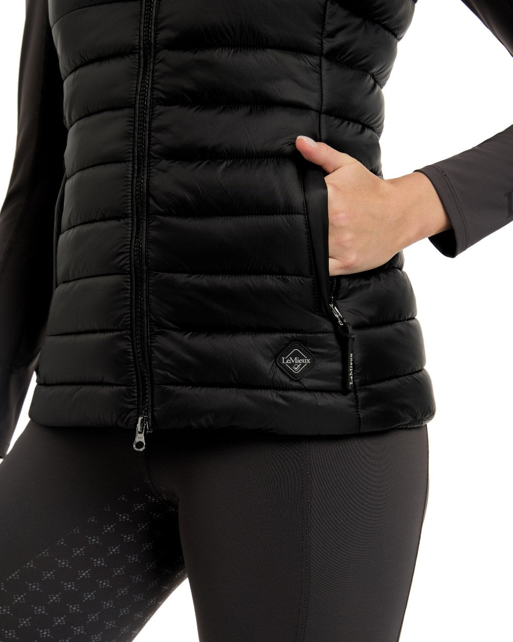 Black coloured LeMieux Tilly Hooded Puffer Gilet on white background