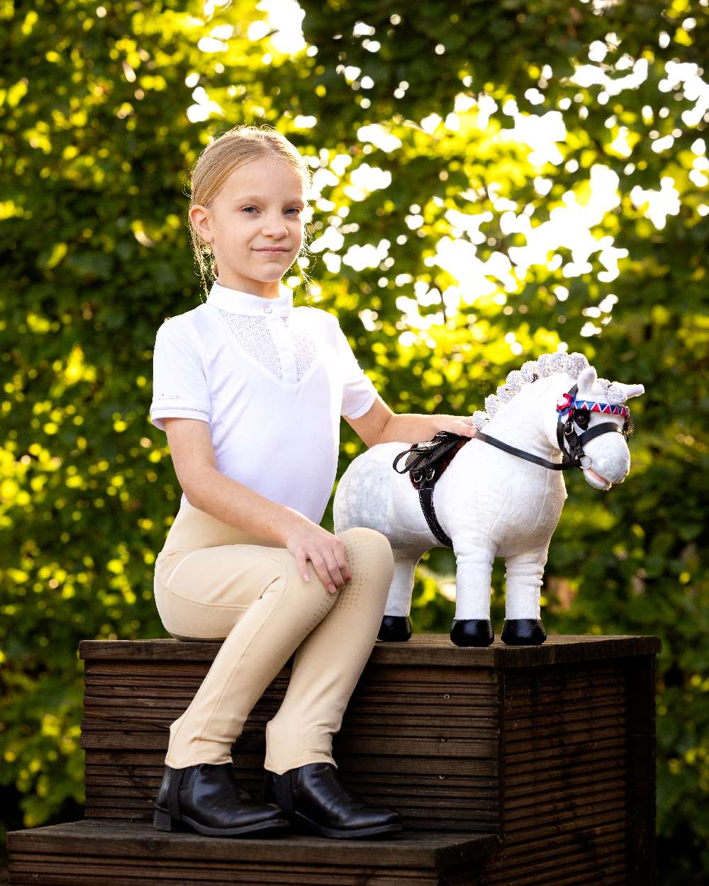Black coloured LeMieux Toy Pony Showing Bridle on park background