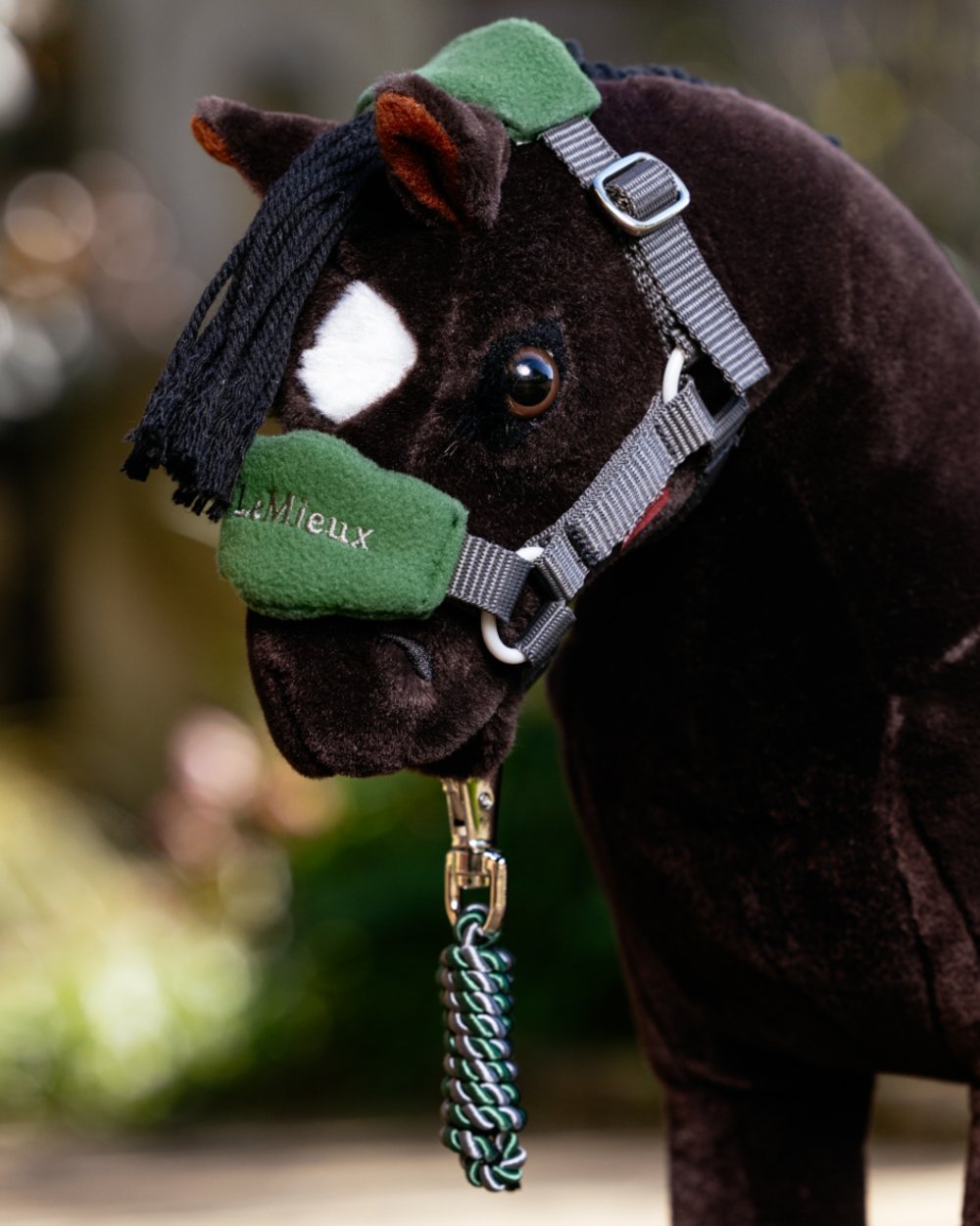 Hunter Green coloured LeMieux Toy Pony Vogue Headcollar on blurry background