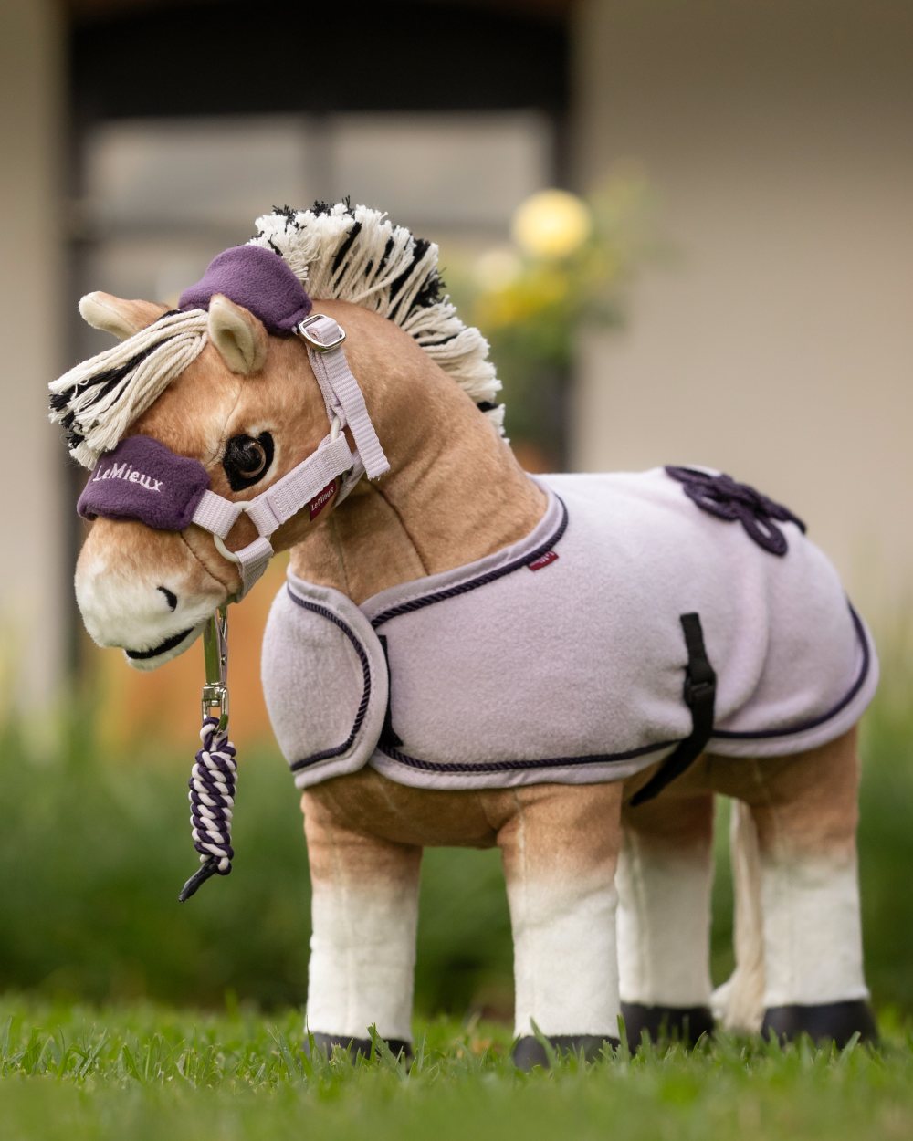 Lilac coloured LeMieux Toy Pony Vogue Headcollar on grassy background