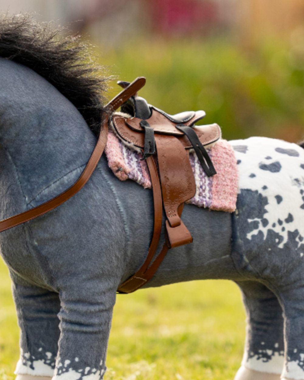 Blossom coloured LeMieux Toy Pony Western Pad on outdoor background