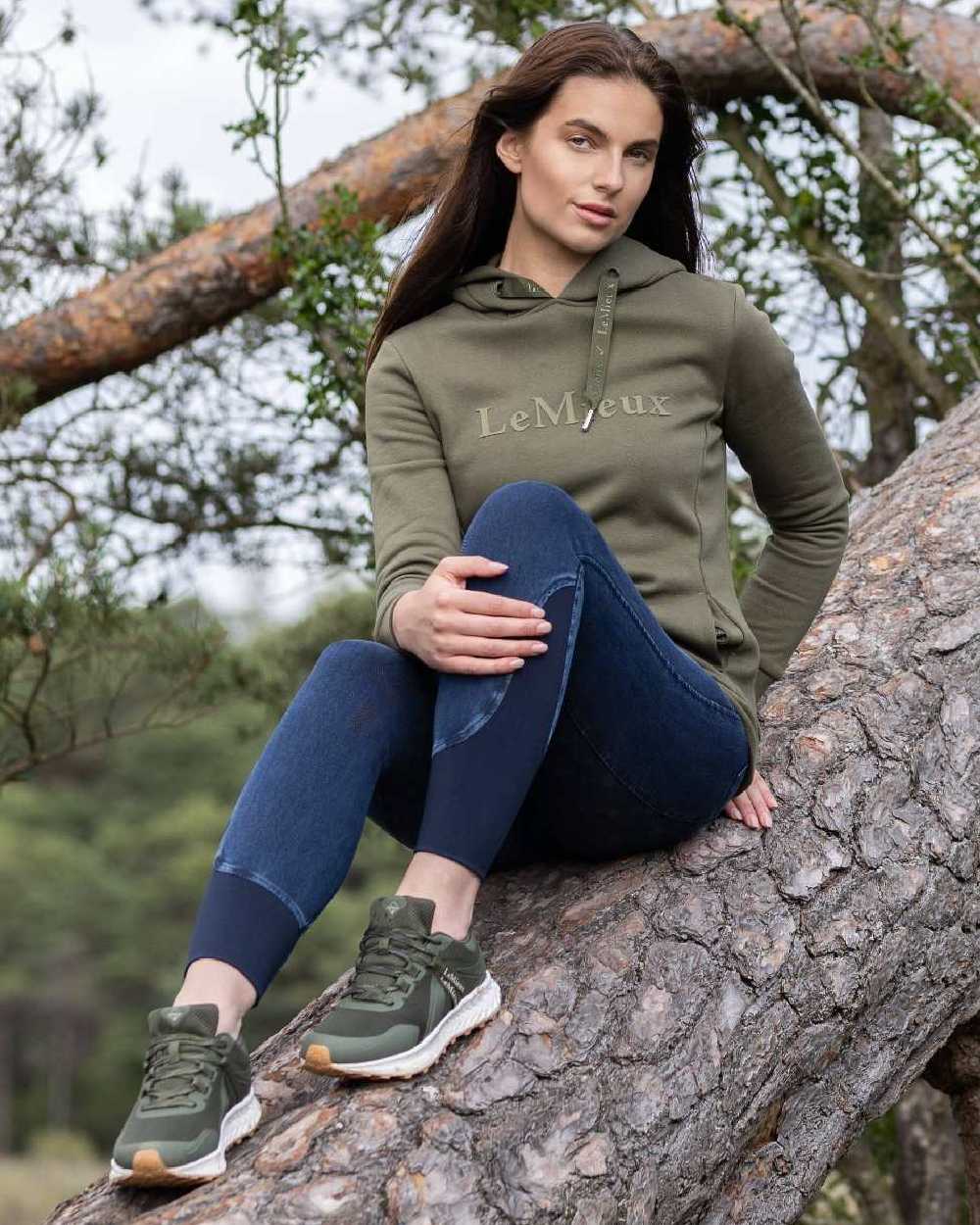 Khaki coloured LeMieux Trax Waterproof Trainers on tree background