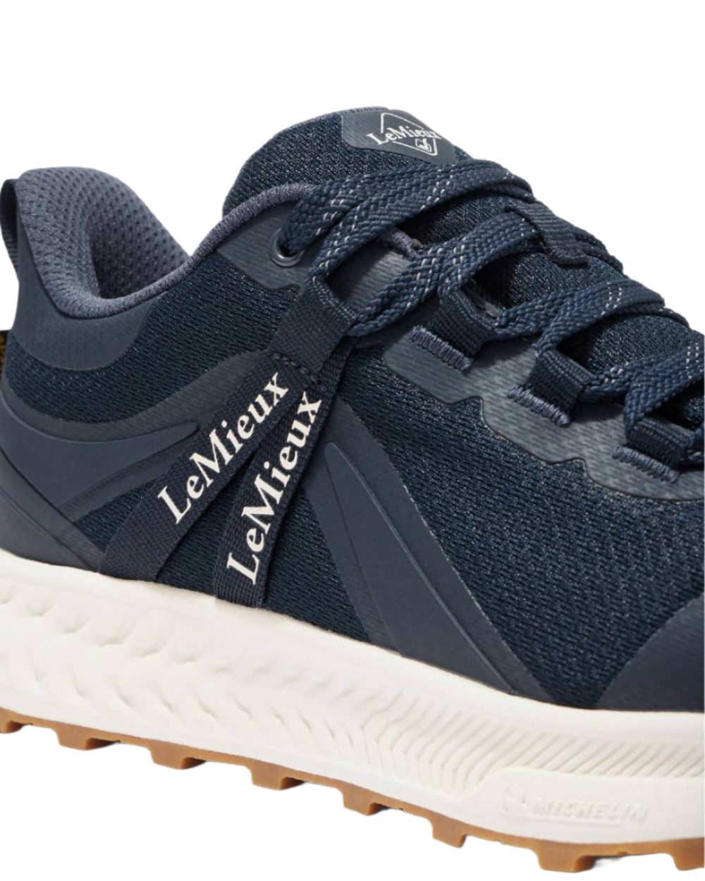 Navy coloured LeMieux Trax Waterproof Trainers on white background