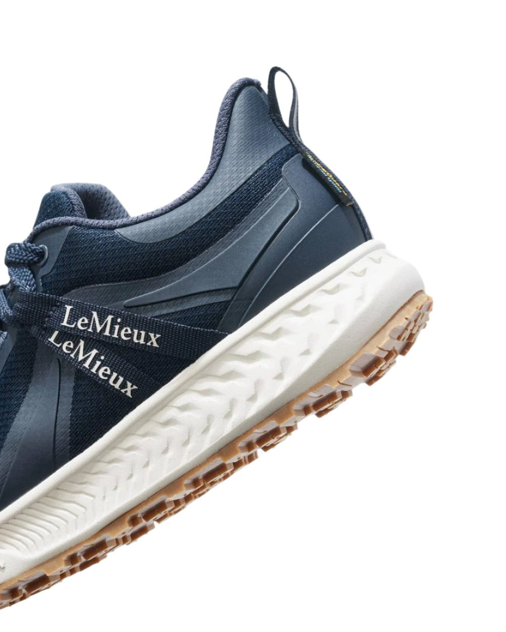 Navy coloured LeMieux Trax Waterproof Trainers on white background