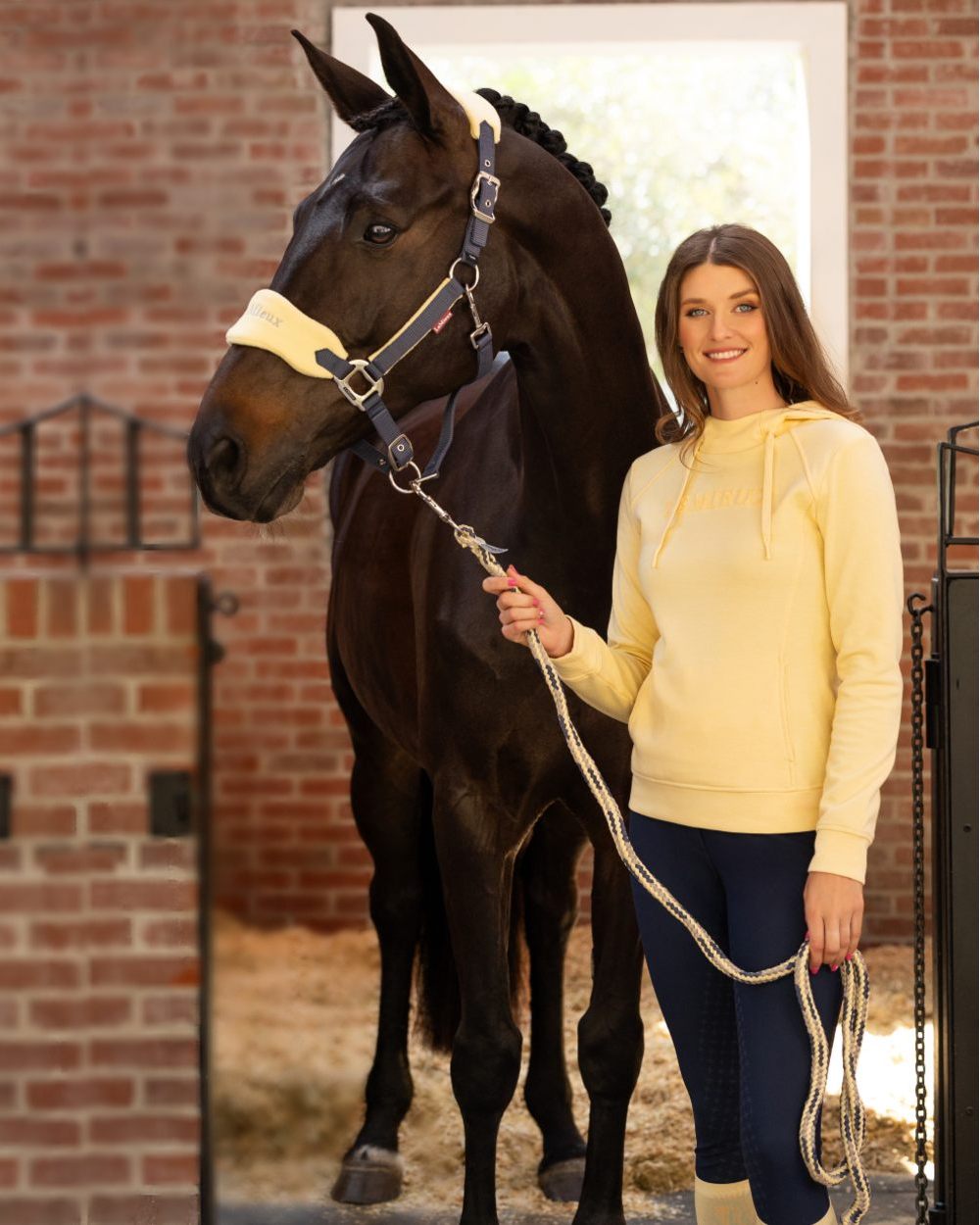 Mimosa coloured LeMieux Vogue Headcollar & Leadrope on wall background