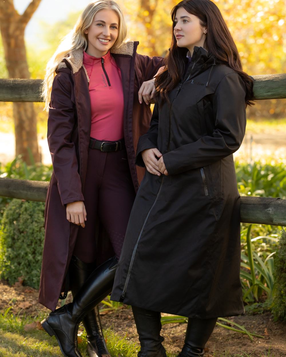 Black coloured LeMieux Womens All Elements Robe Coat on outdoor background