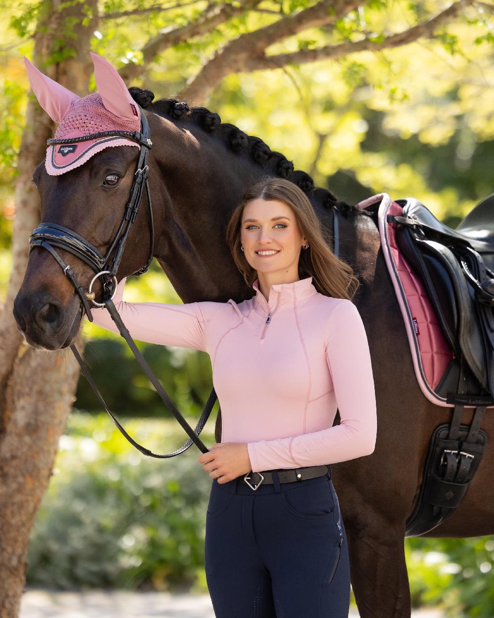 Blossom coloured LeMieux Womens Base Layer on backyard background