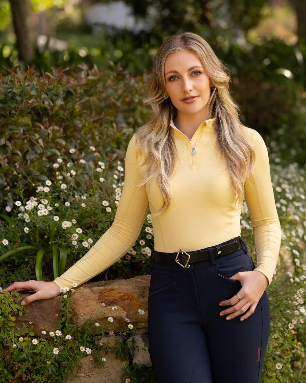 Mimosa coloured LeMieux Womens Base Layer on backyard background