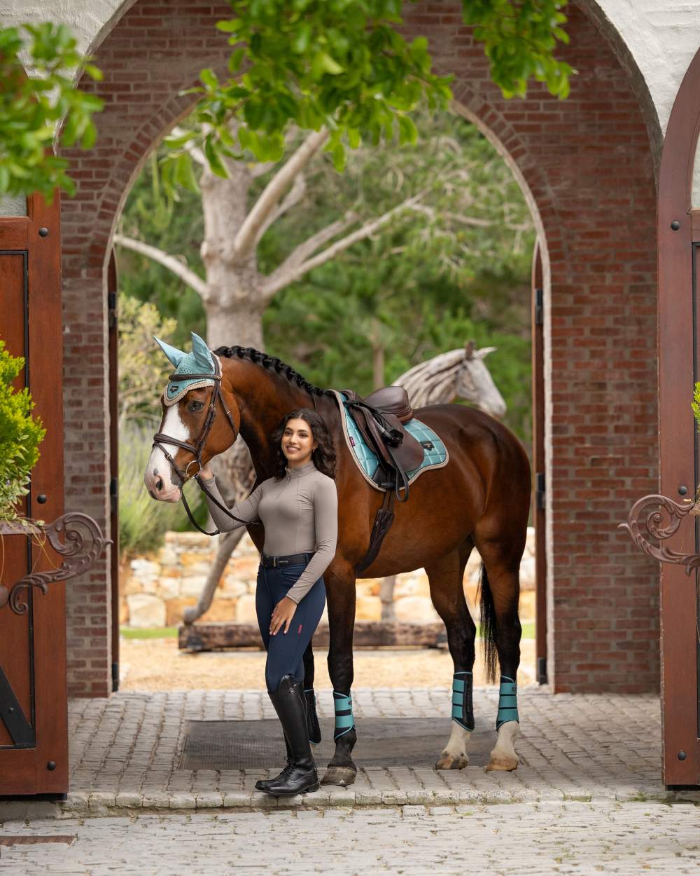 Pecan coloured LeMieux Womens Base Layer on wall background