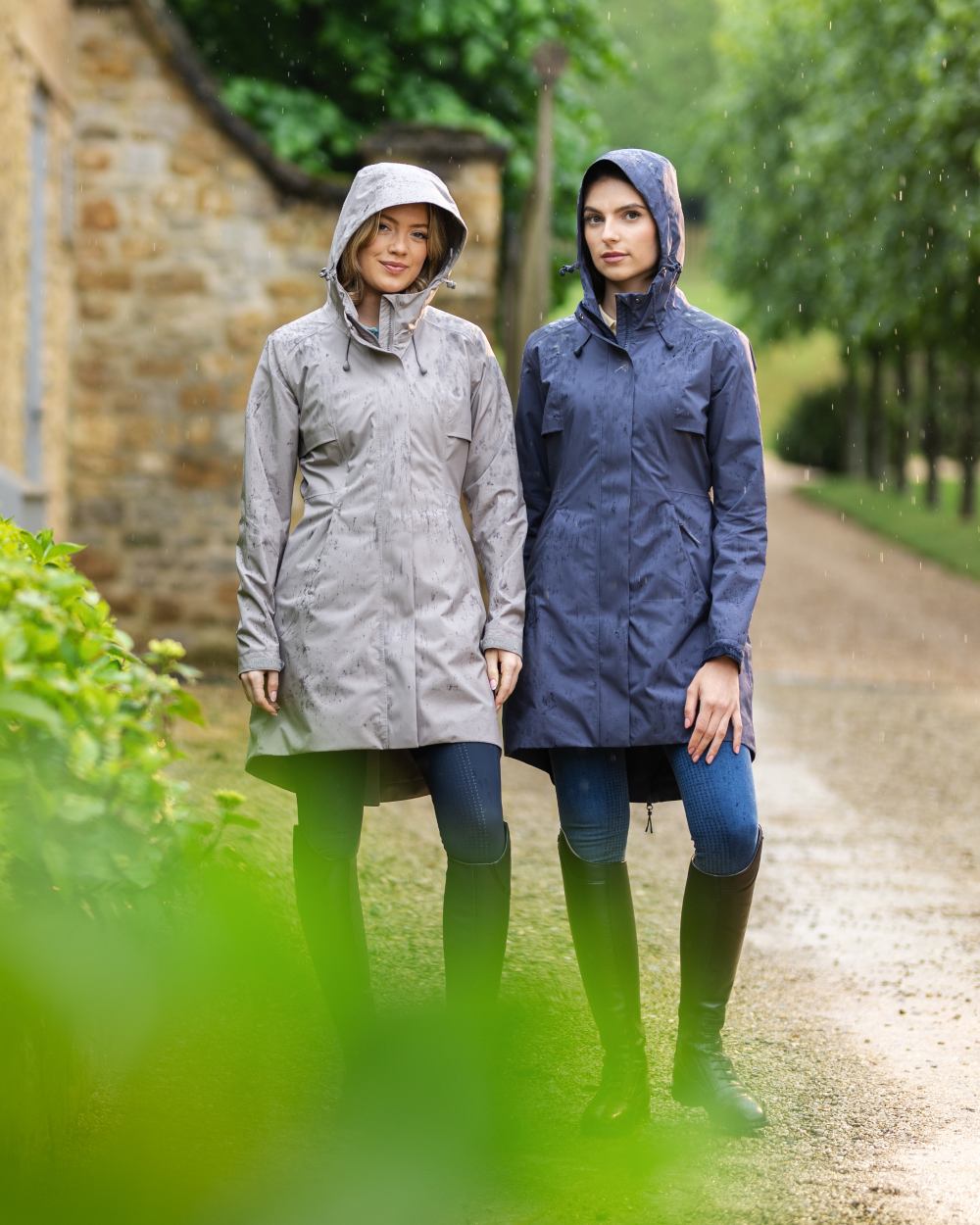 Dusk Blue coloured LeMieux Womens Grace Long Rain Jacket on street background