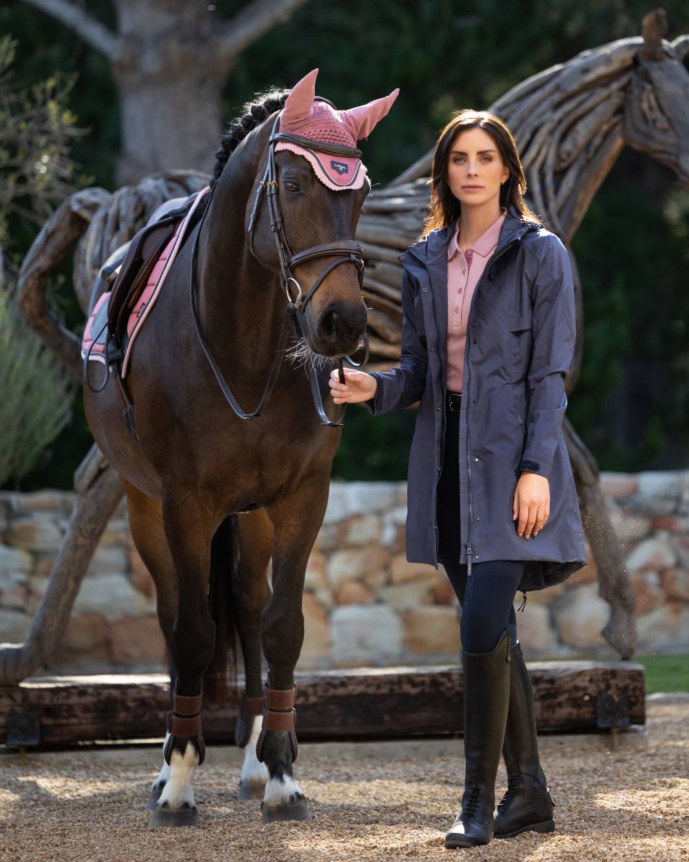 Dusk Blue coloured LeMieux Womens Grace Long Rain Jacket on lawn background