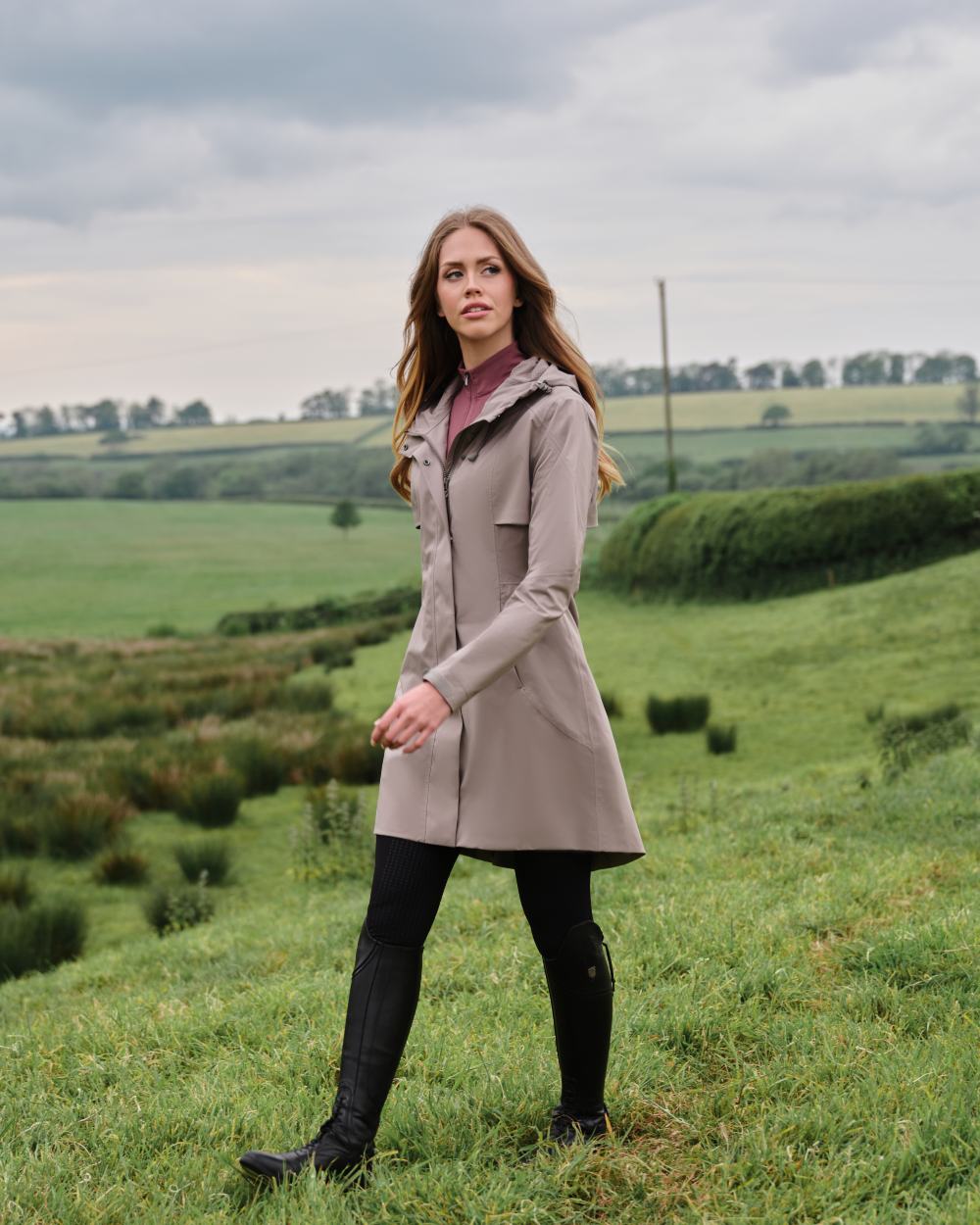 Pecan coloured LeMieux Womens Grace Long Rain Jacket on lawn background