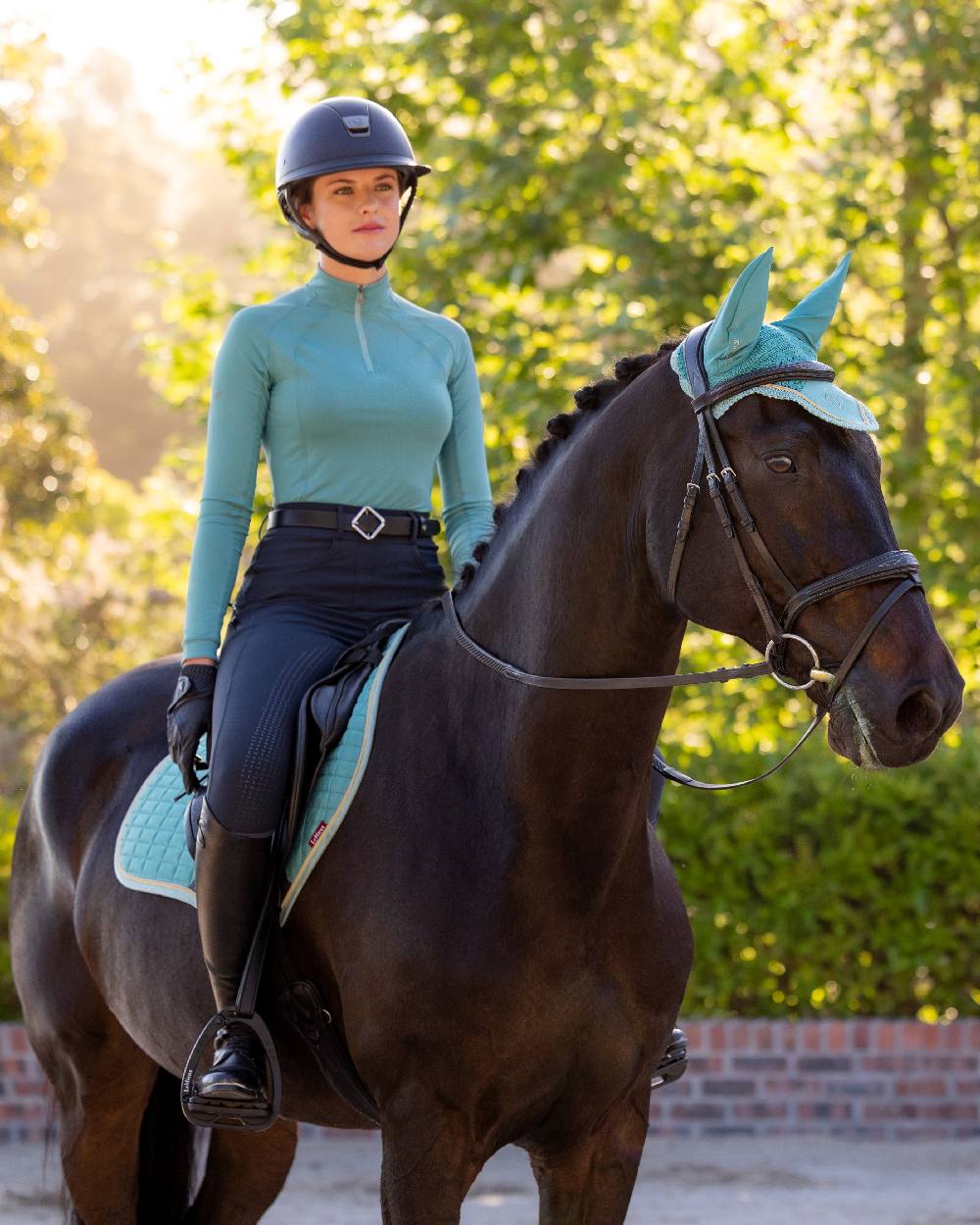 Lagoon coloured LeMieux Womens Halle Lightweight Base Layer on street background
