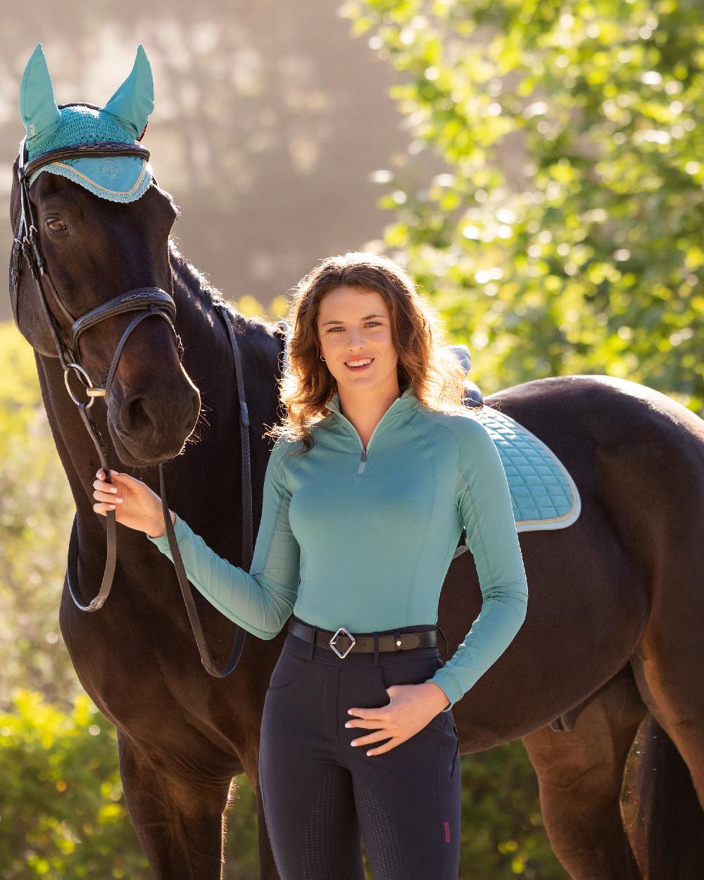 Lagoon coloured LeMieux Womens Halle Lightweight Base Layer on street background