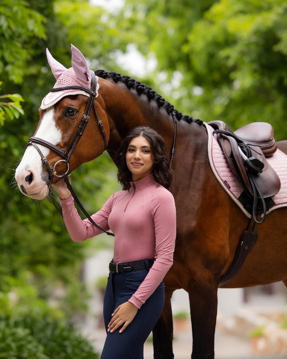 Peony coloured LeMieux Womens Halle Lightweight Base Layer on backyard background