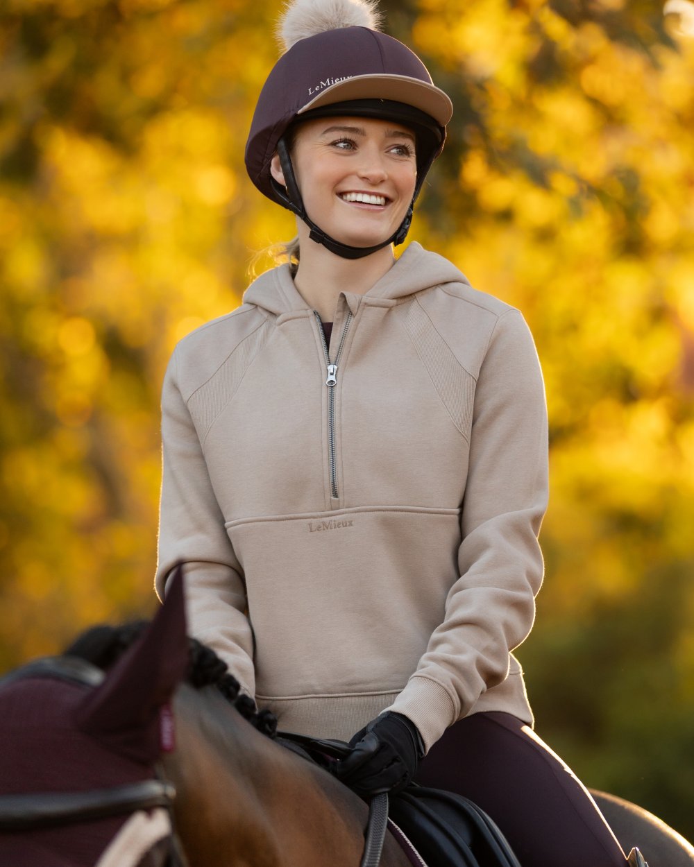 Almond coloured LeMieux Womens Henrietta Half Zip Hoodie on tree background