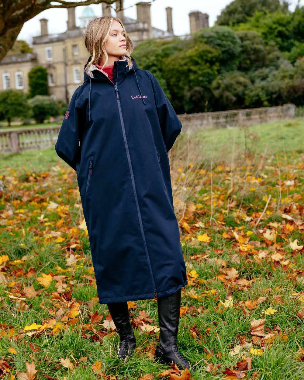 Navy coloured LeMieux Womens HydroShield Robe Long Coat on outdoor background