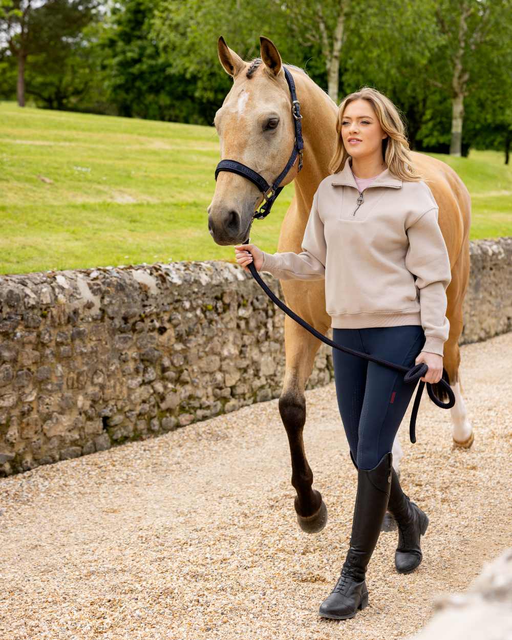 Almond coloured LeMieux Womens Keira Quarter Neck Sweatshirt on street background