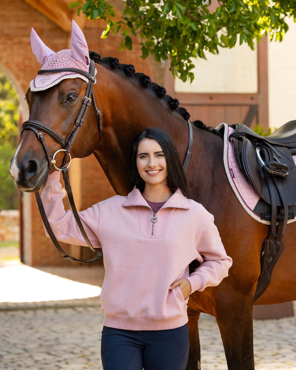 Blossom coloured LeMieux Womens Keira Quarter Neck Sweatshirt on street background