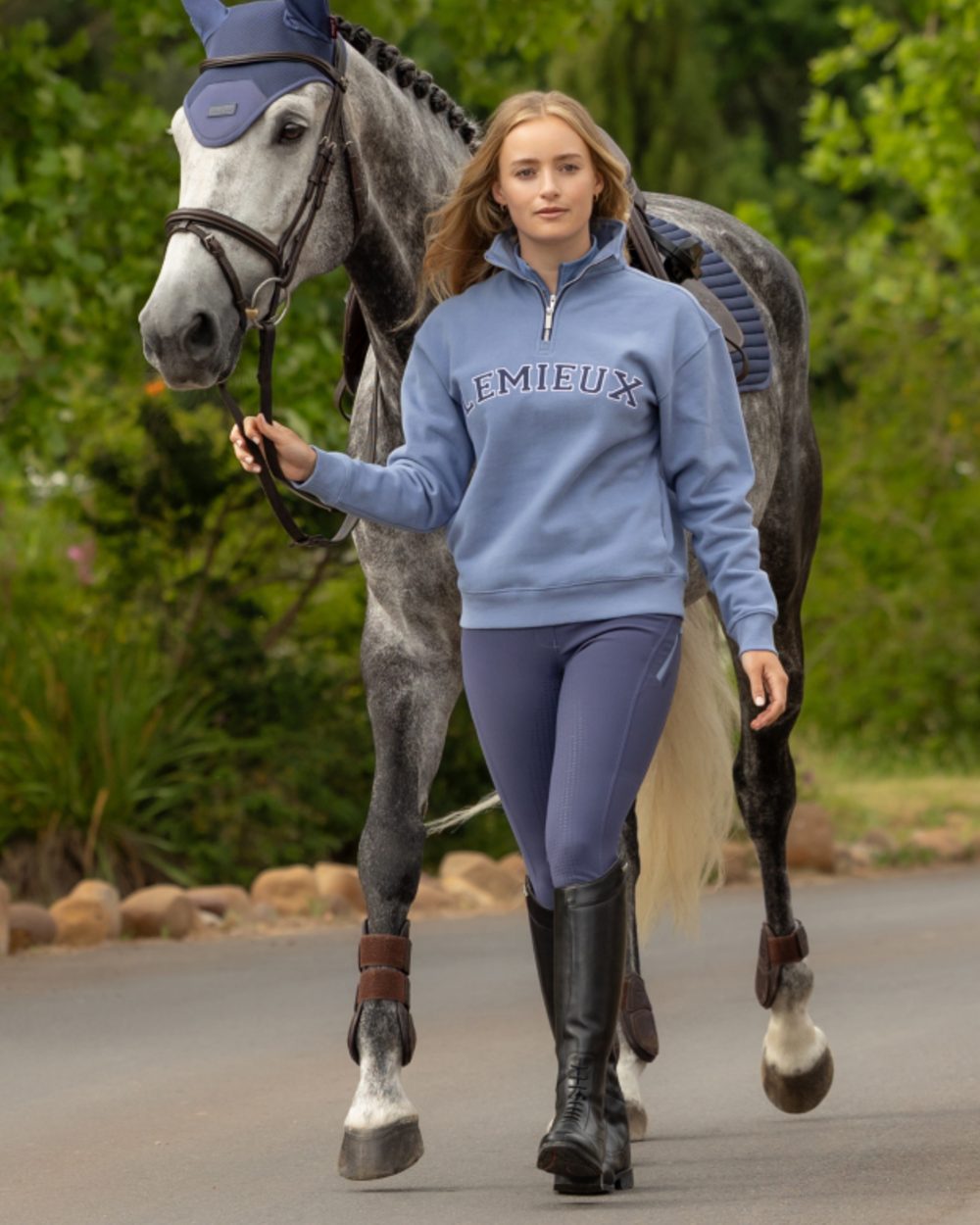 Powder Blue coloured LeMieux Womens Kelsie Quarter Neck Sweatshirt on outdoor background