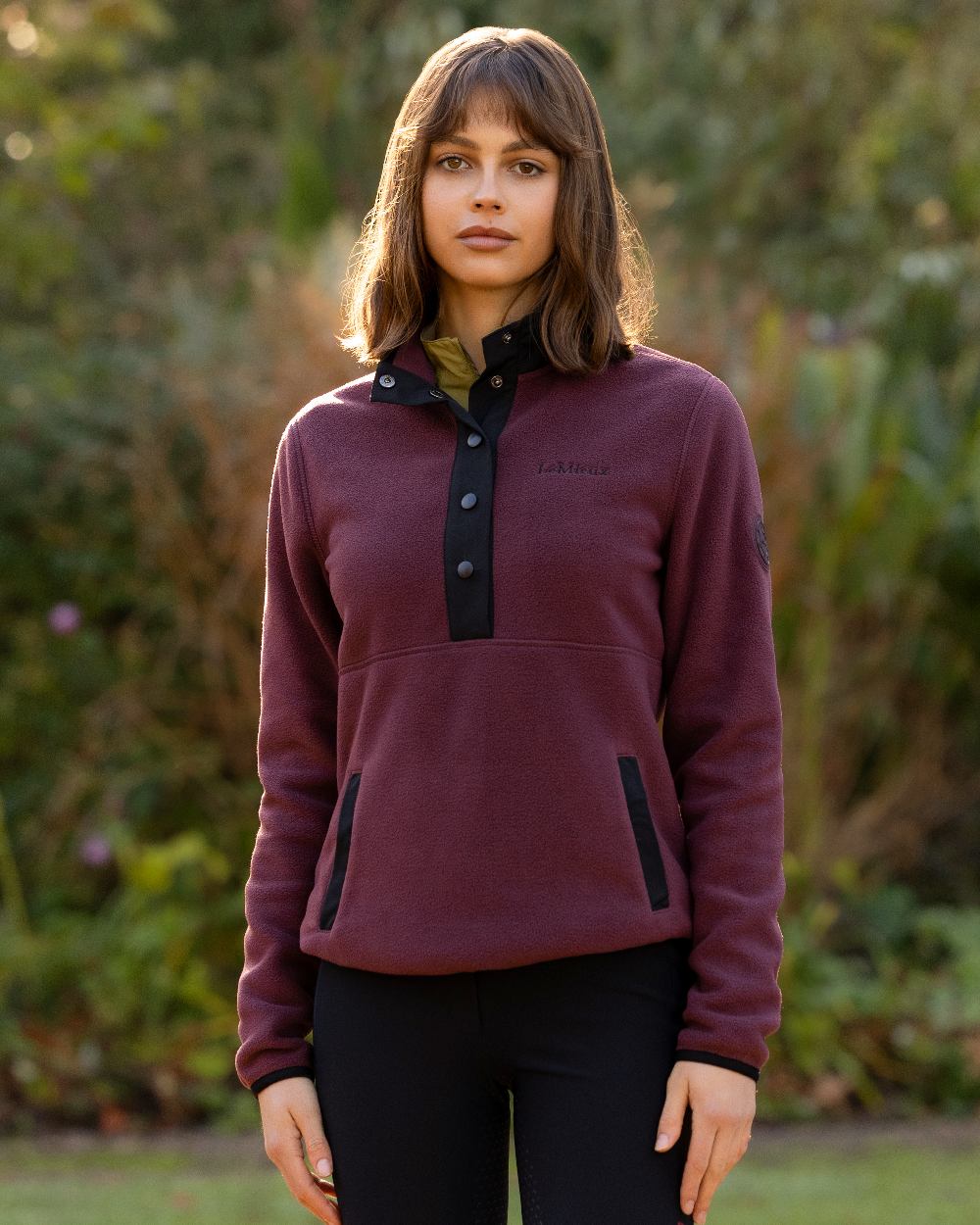 Bramble Coloured LeMieux Womens Piper Popper Fleece on Outdoor Ground Background