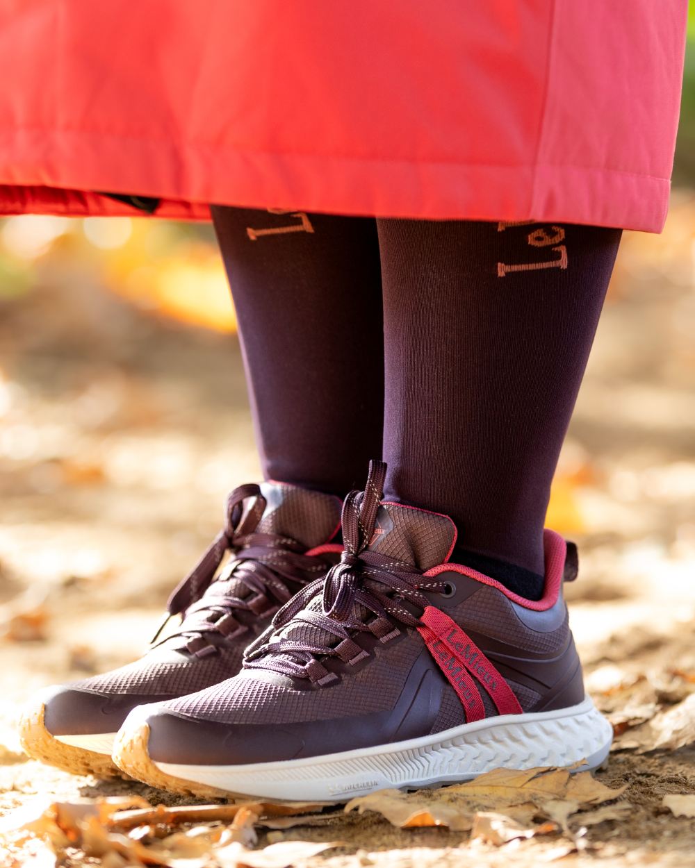 Damson Coloured LeMieux Womens Trax Viva Waterproof Trainer Shoes on outdoor background
