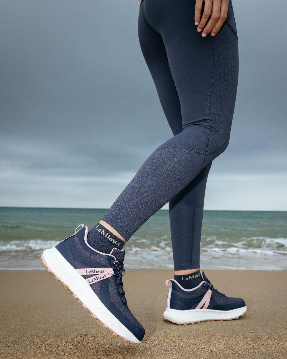 Dusk Coloured LeMieux Womens Trax Viva Waterproof Trainer Shoes on sea background