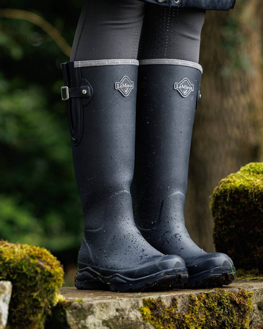 Navy Coloured LeMieux Womens Ultra Stride Wellington Boots on forest background