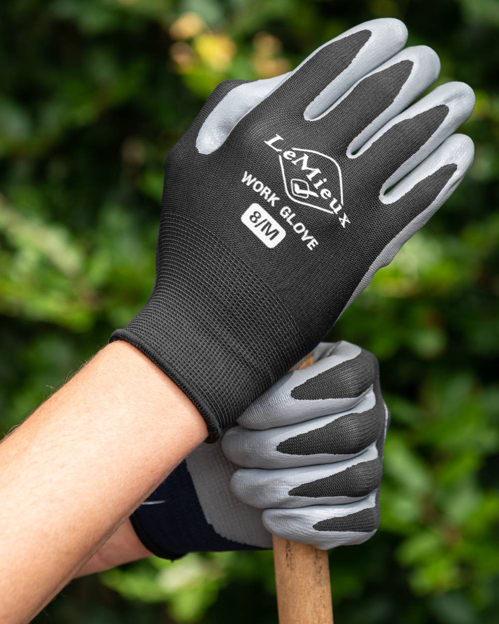 Black coloured LeMieux Work Gloves on outdoor background