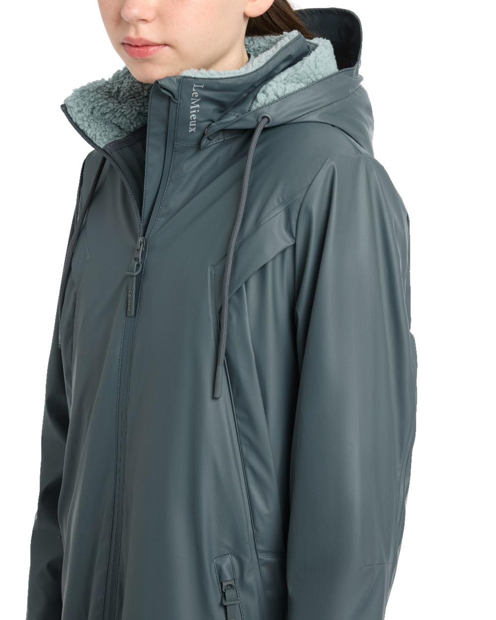 Petrol coloured LeMieux Young Rider All Elements Coat on white background