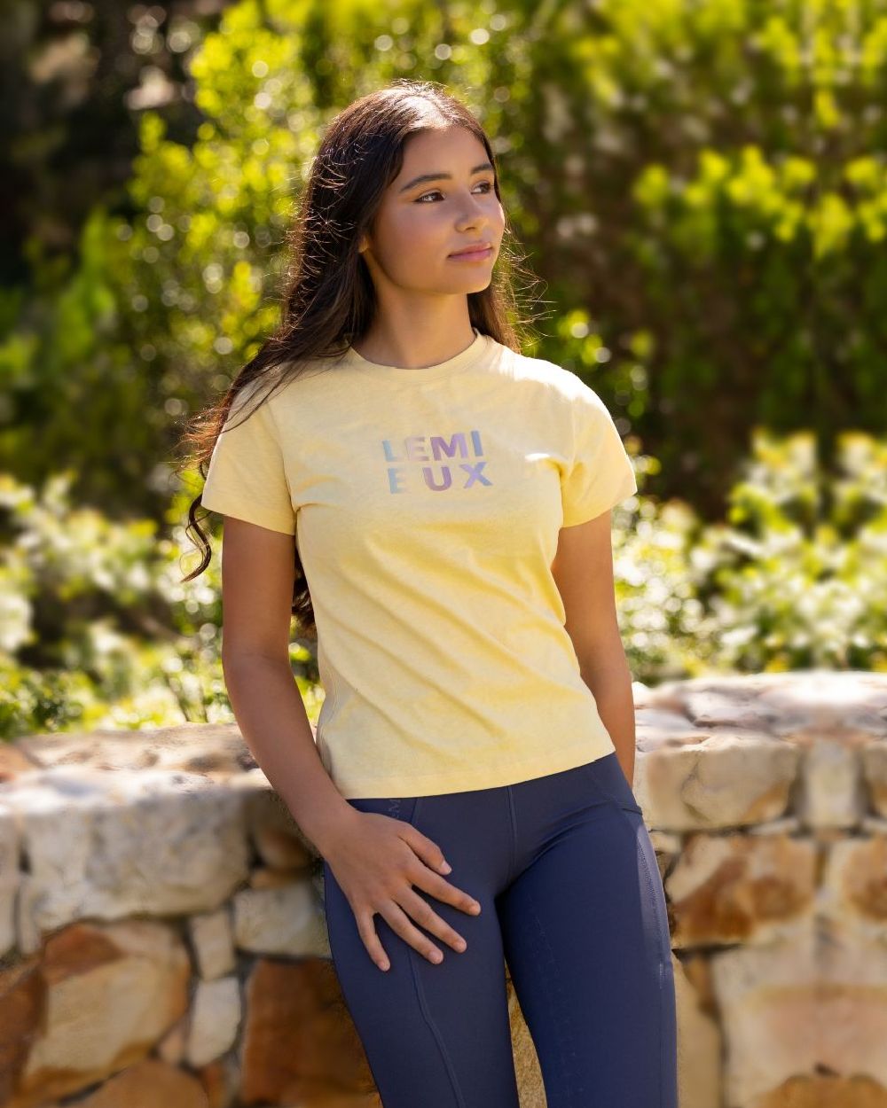 Mimosa coloured LeMieux Young Rider Arianna T-Shirt on backyard background