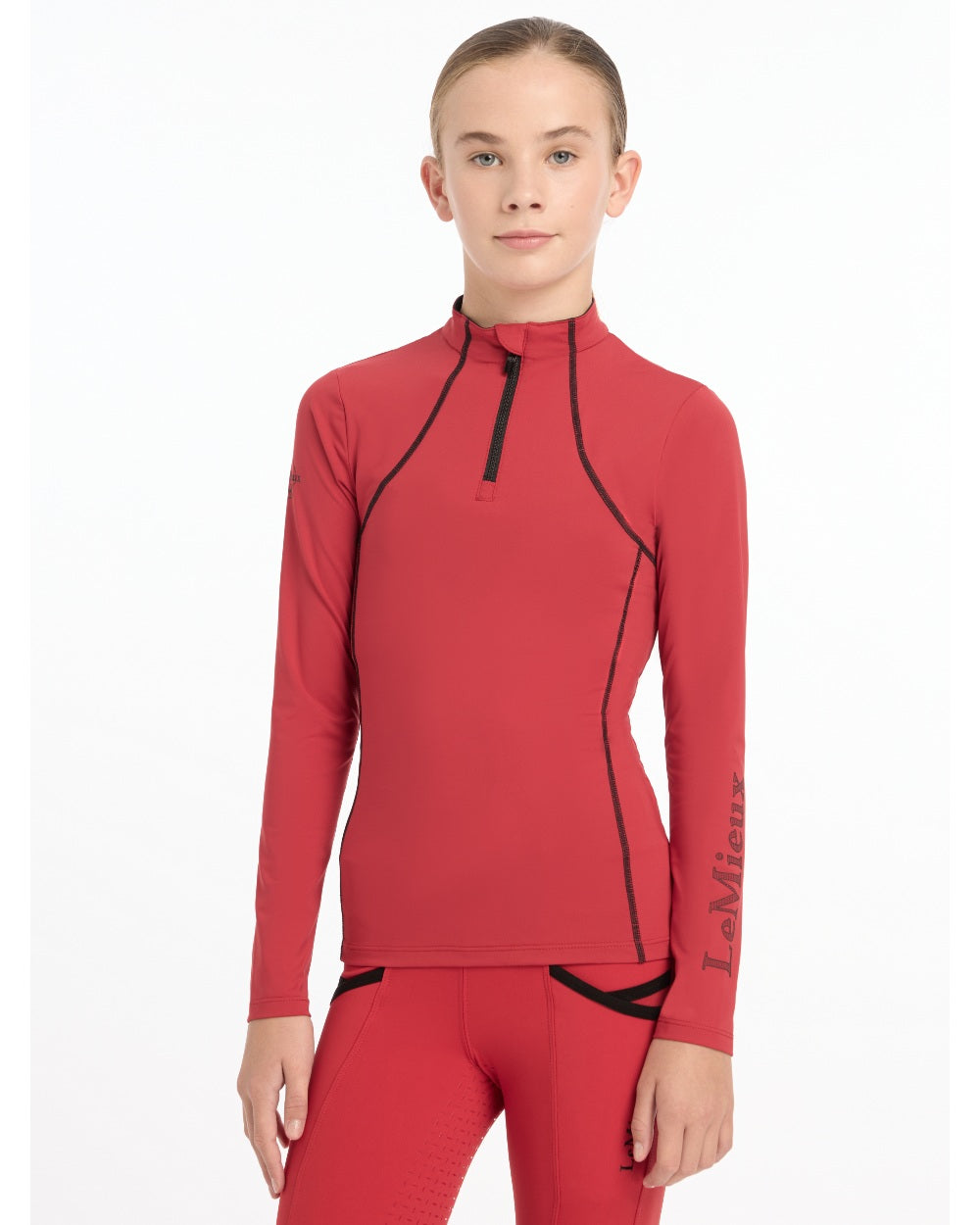Chilli coloured LeMieux Young Rider Base Layer on white background