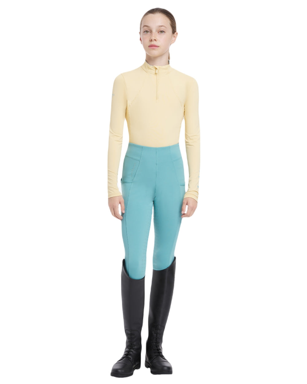Mimosa coloured LeMieux Young Rider Base Layer on white background